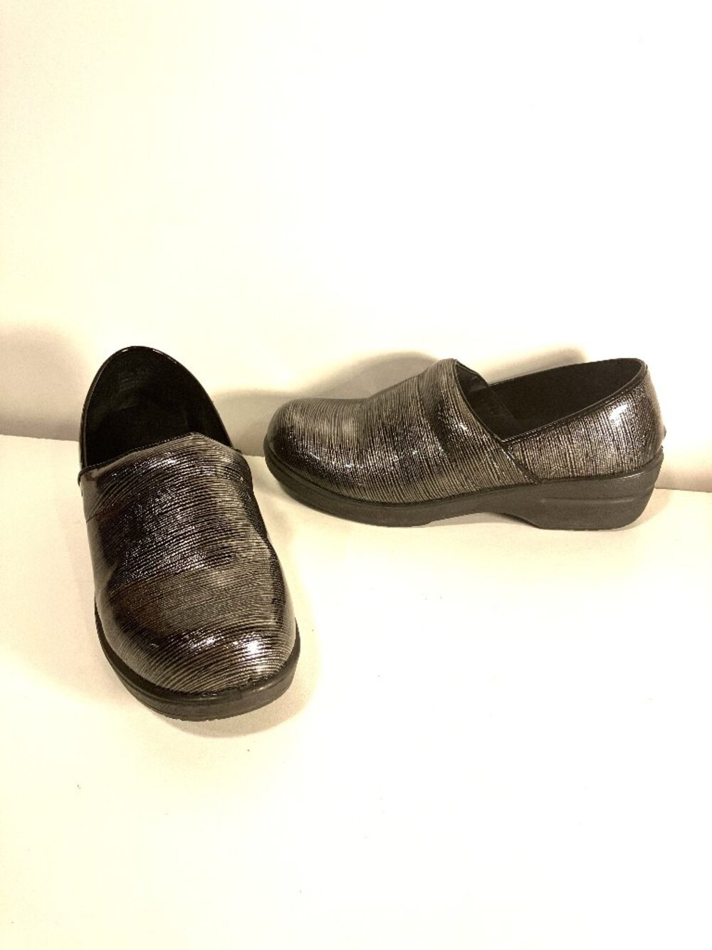 INGARO Slip-On Clogs.  Size 10.  Metallic sliver/black stripe pattern.